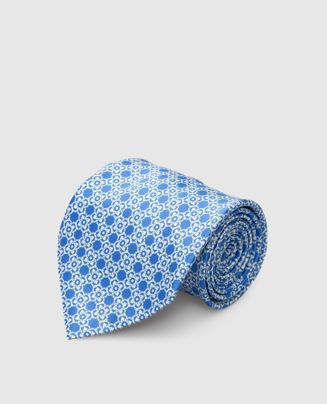 Blue silk tie in a geometric pattern