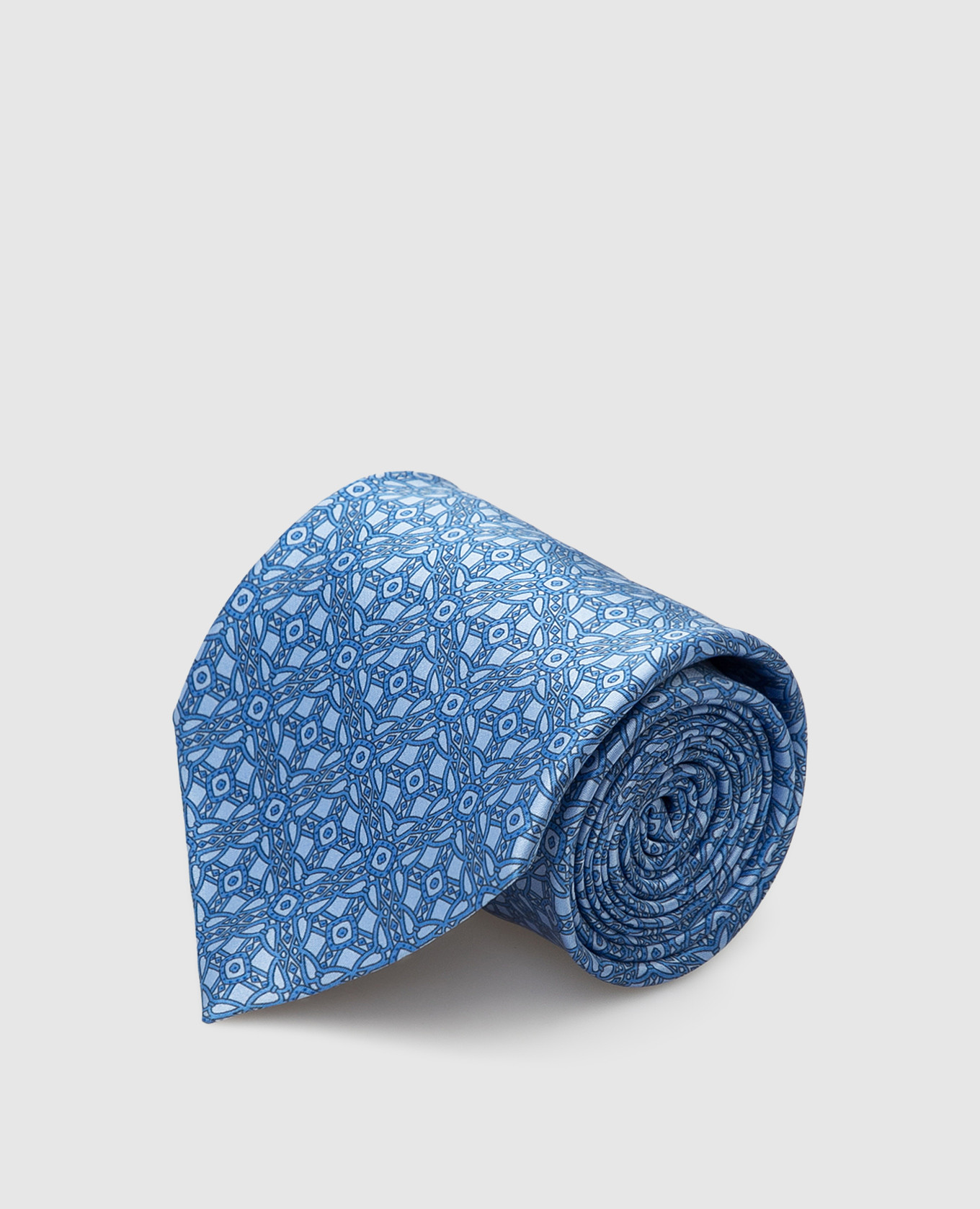 Blue silk tie in a geometric pattern